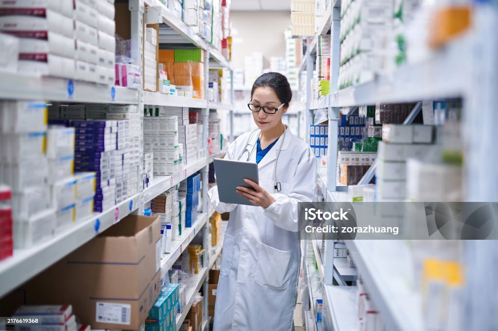 Pharmacist reviewing inventory